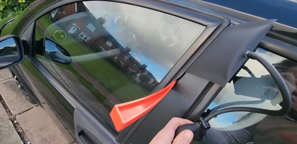 Automotive locksmith opening a locked car door in Wichita Falls